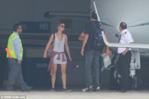 Jennifer Lawrence and Chris Martin Getting Off Jet Plane - Sept 22nd